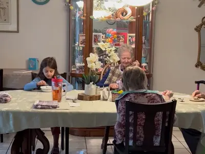 Olimpia Senior Care - residents having lunch with kids